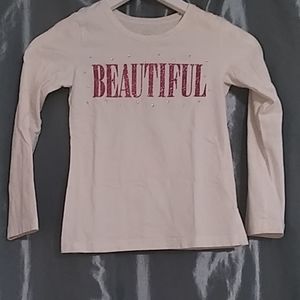 A white long sleeve shirt with "beautiful" on it